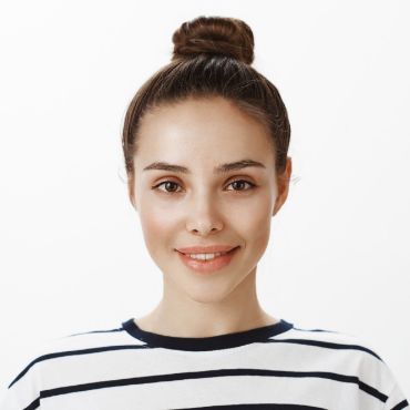 A young woman wearing a striped t - shirt.