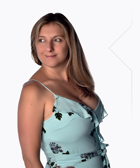 A woman in a blue dress posing for a photo.